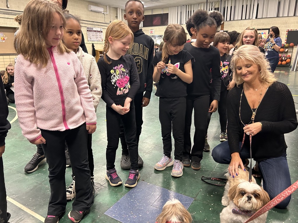 students smiling at two Lilly and Livingston the authors real dogs