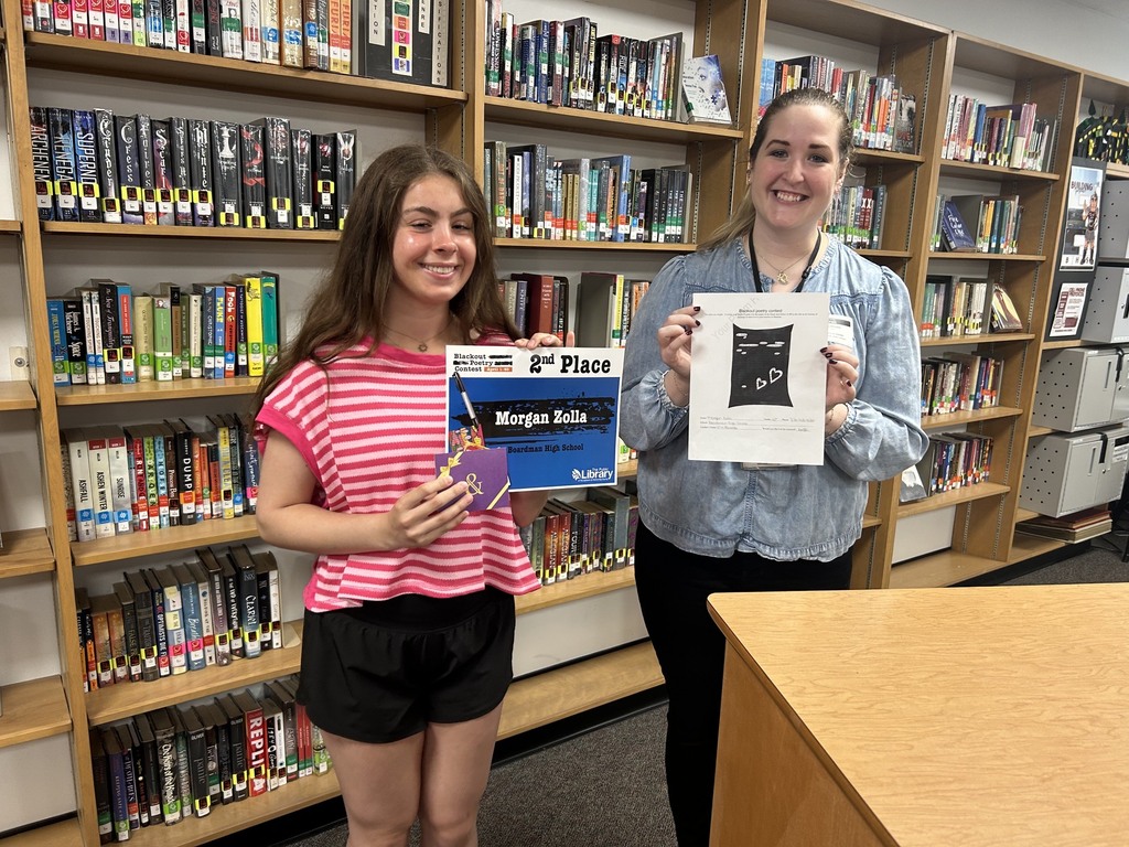 Morgan Zolla and Librarian with awards