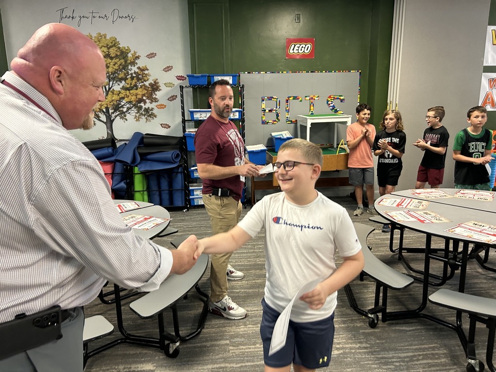 5th grader Rowan Hartup accepting certificate from Supt. Neifer