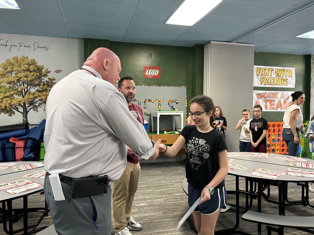 4th grader Anna Hassan accepting certificate from Supt. Neifer