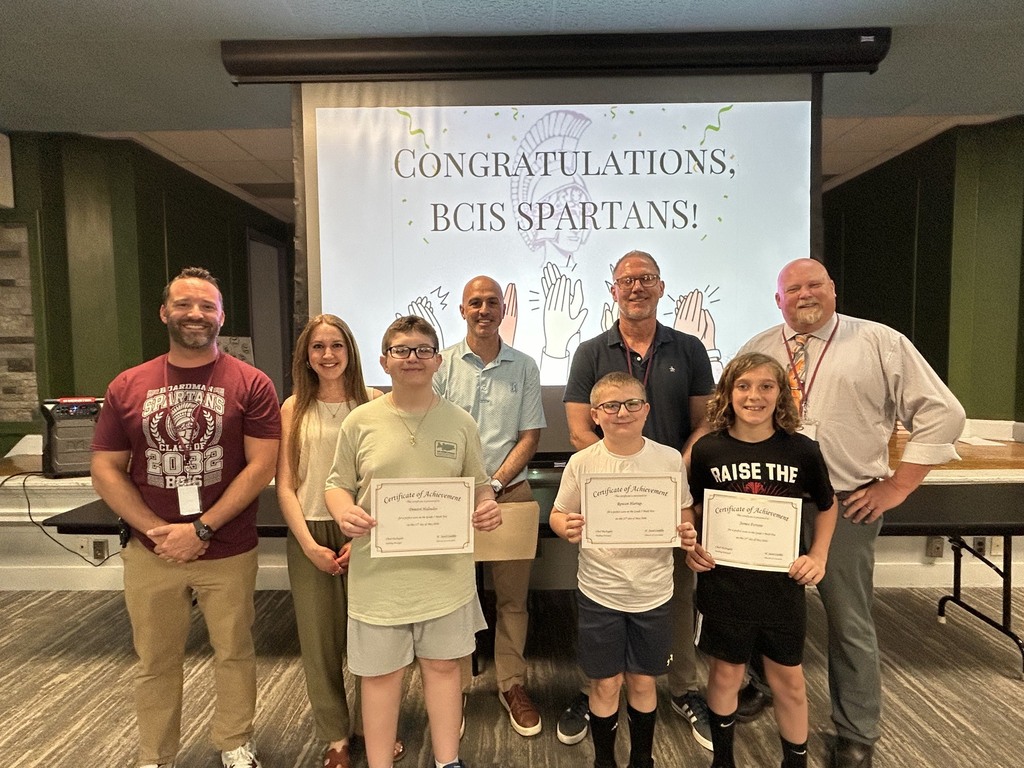 5th grade perfect math students with teachers , principal and superintendent