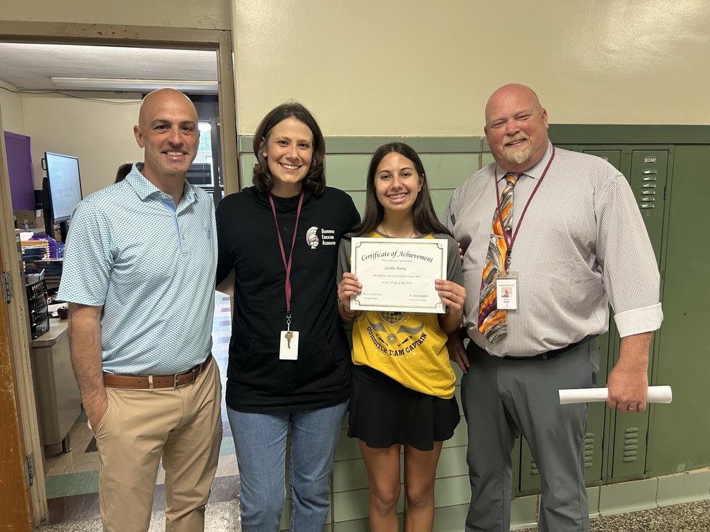 cecilia holding her perfect science certificate with mrs. frost, supt. Niefer and Mr Cardillo