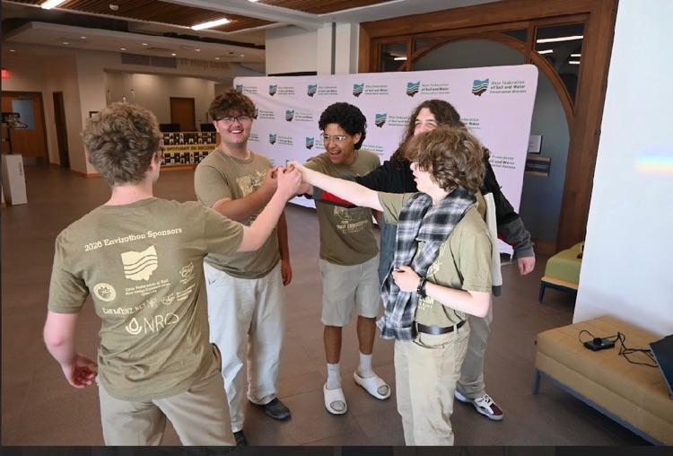 students high fiving