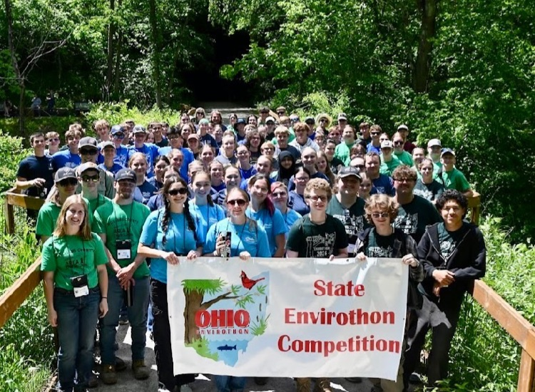 student with state Envirothon banner