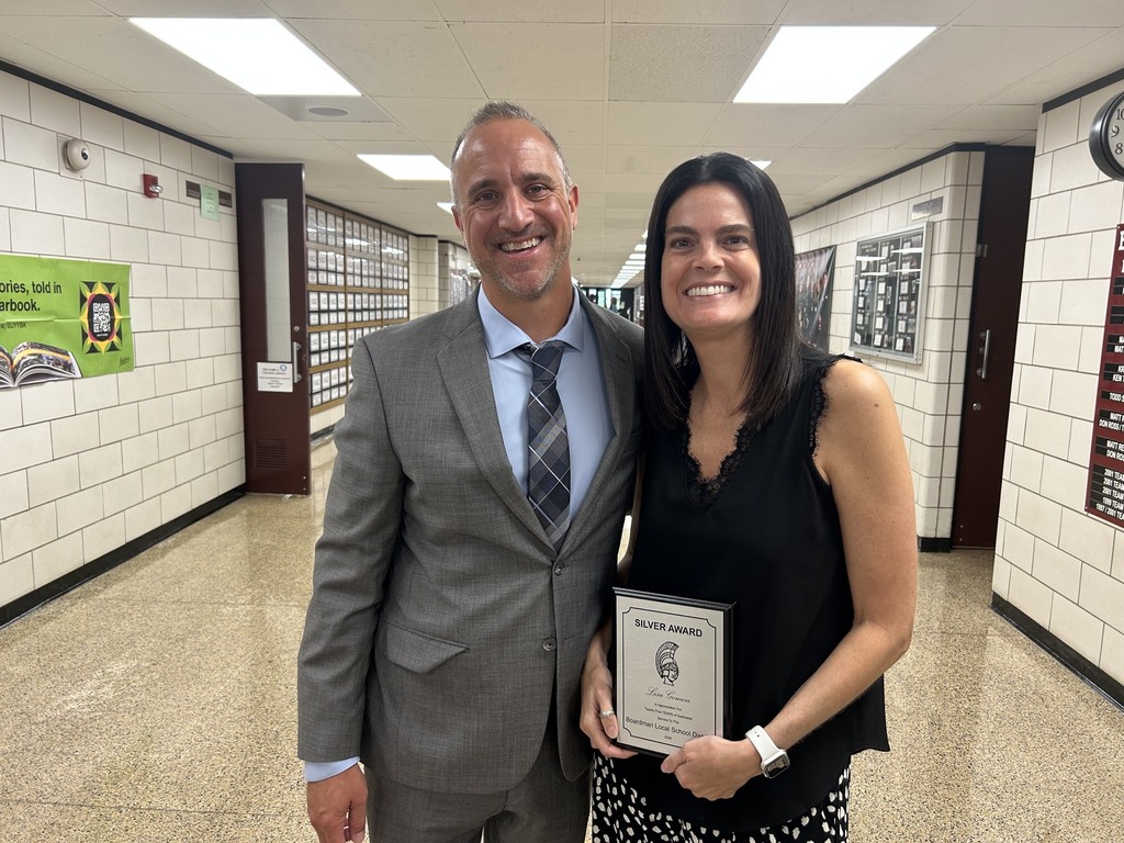 Principal Zocalli with Mrs. Goman-Miller and her 25 year award