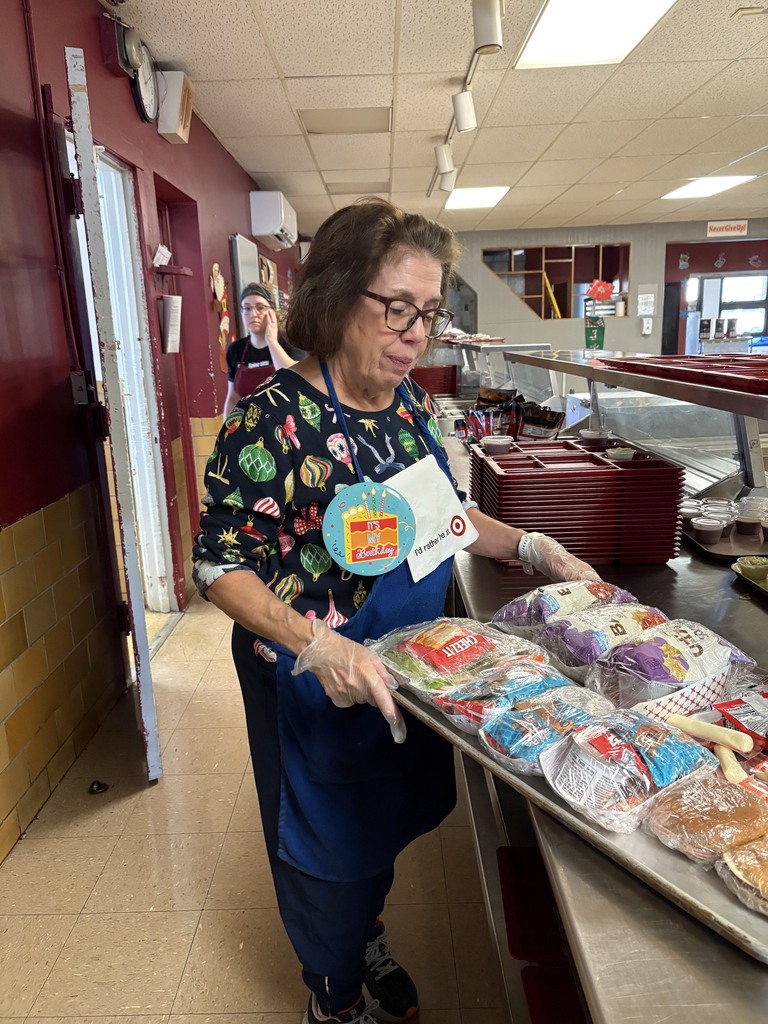 Mary Ann putting out lunch trays at BCIS