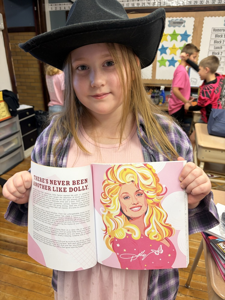 student holding a book about Dolly