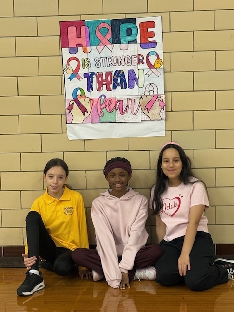 Jr YAC created Collaborative Posters throughout BMS to promote October as Breast Cancer Awareness Month!! Haoua, Beverly & Stephanie proudly display their effort along with the other JR YAC members!!