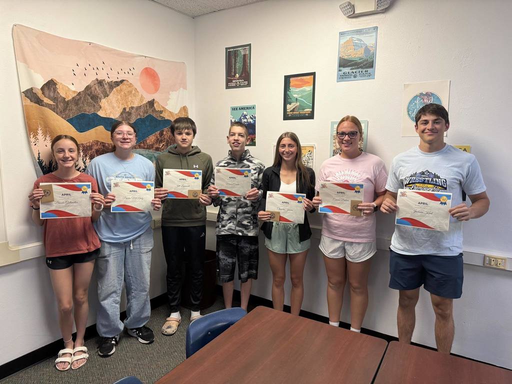 Group of students holding diplomas