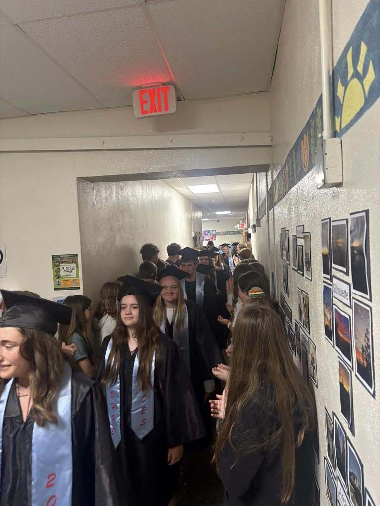 High School graduates walking down the hall