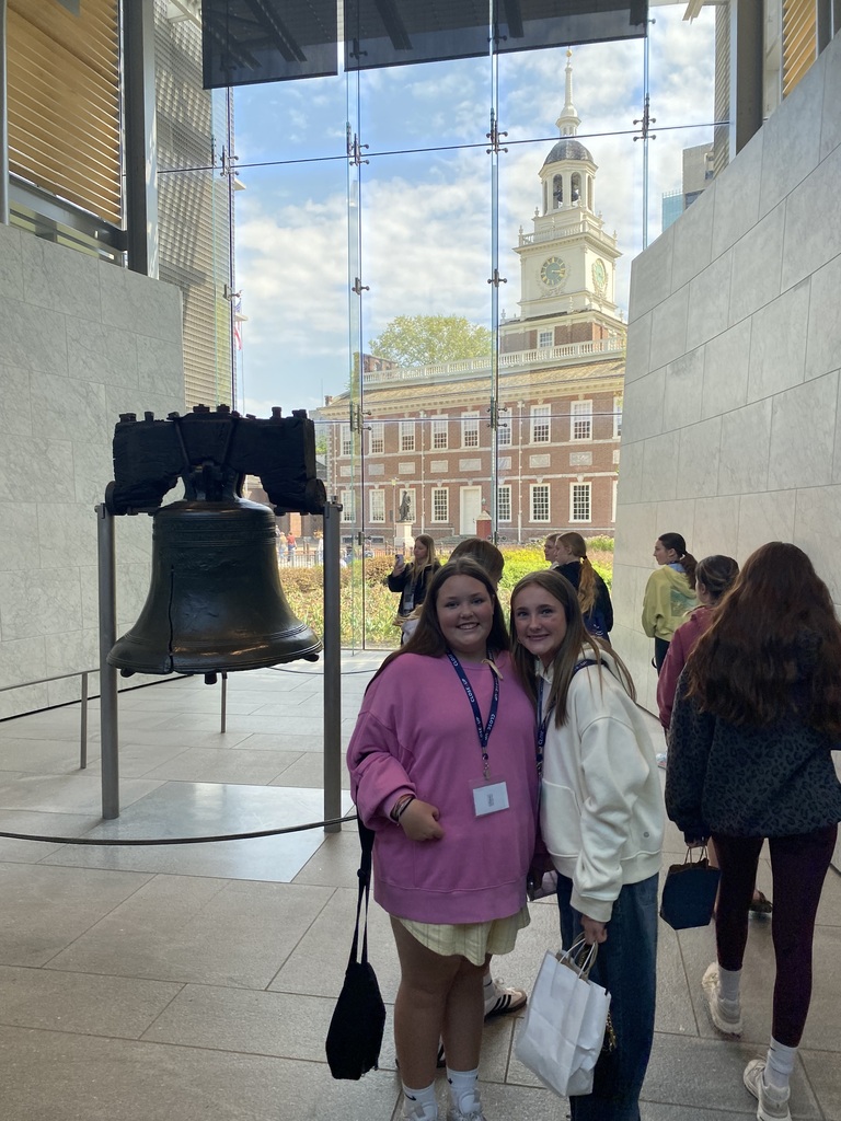The Liberty Bell with Independence Hall in the background. 