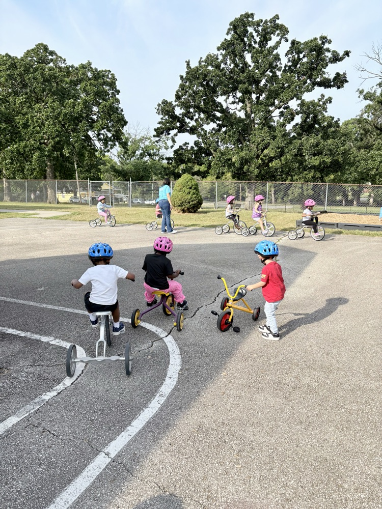 kids riding on tricycles