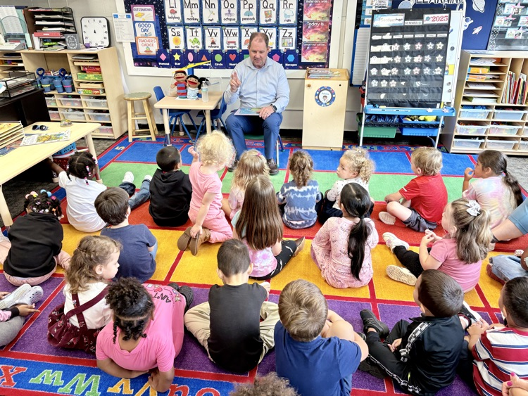 superintendent Moulin talking to a preschool class about how to have a successful year