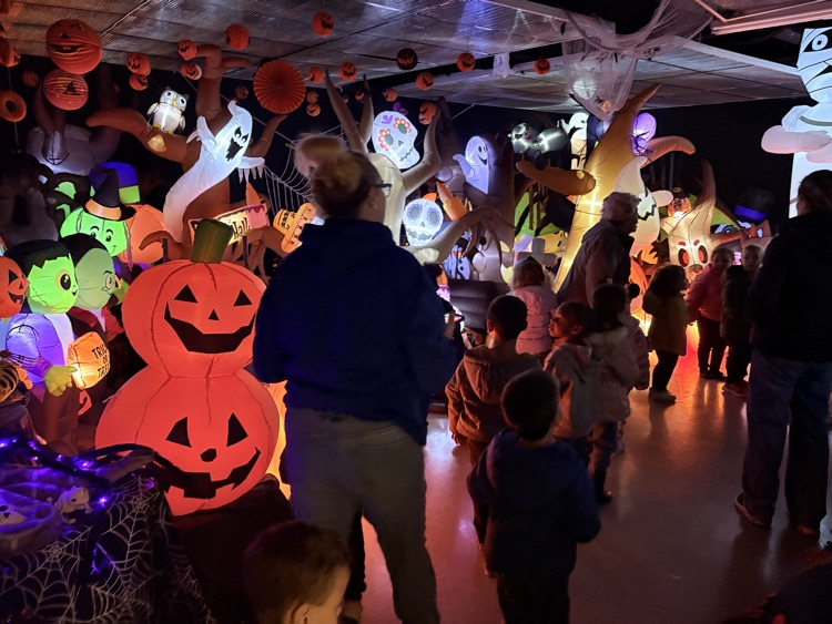 the kids walk through the spook house