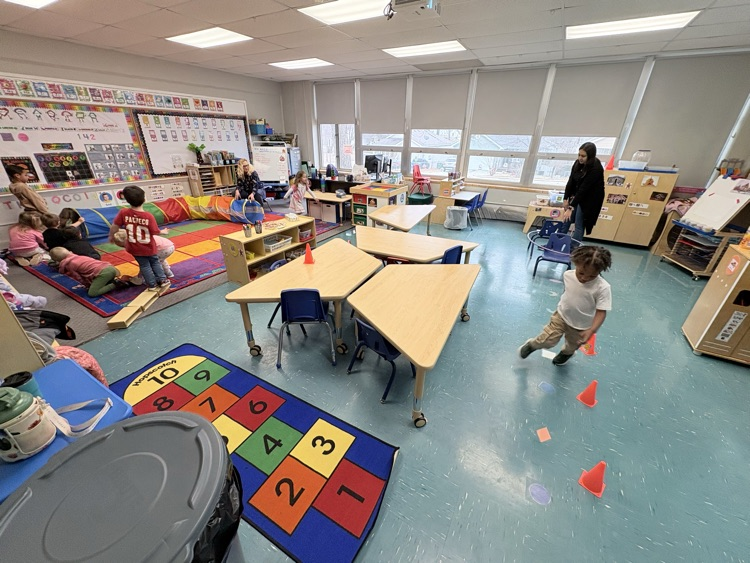 kids doing an indoor obstacle course
