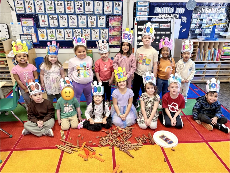 kids from the blue room wearing their 100th day crowns