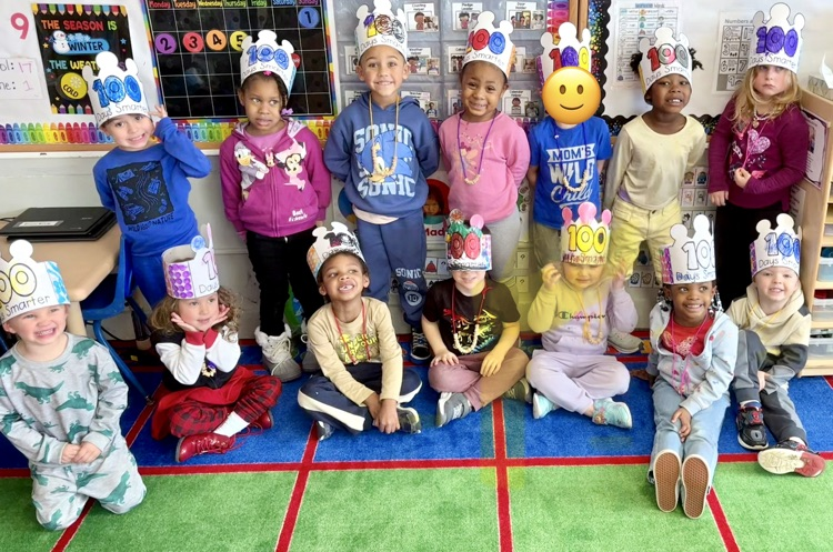 kids from the green room wearing their 100th day crowns
