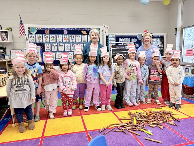 blue room wearing their Dr Seuss hats