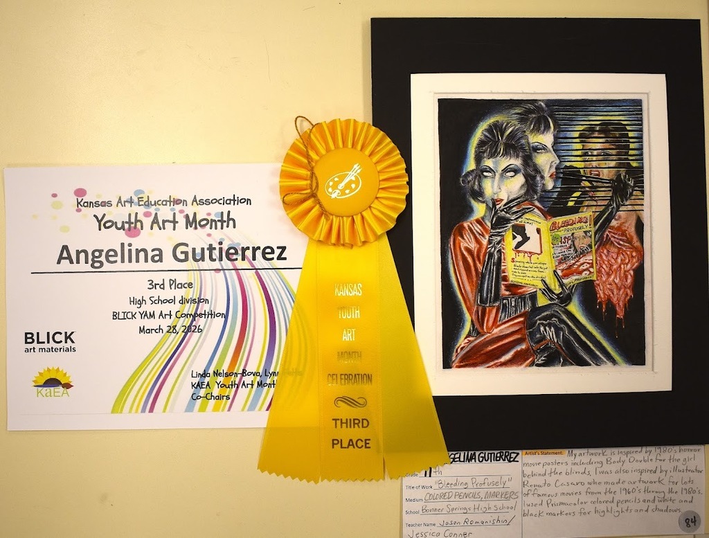 Display of a yellow award ribbon, certificate with 'Third Place', and a framed artwork featuring two figures.