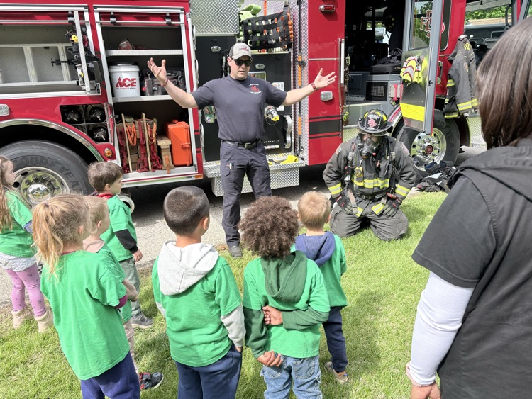 the fireman demonstrating their safety gear