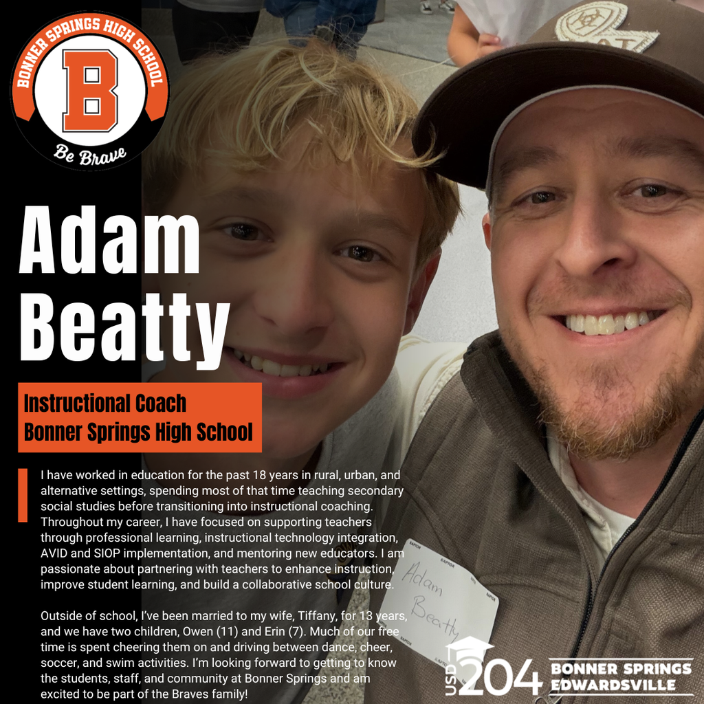 A man with a beard and a cap smiles at a boy.