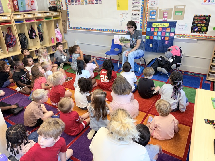 miss Amy and Hollywood from the Bonner Springs library read to the classes