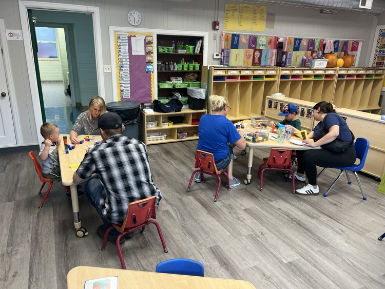 families play with blocks at tables
