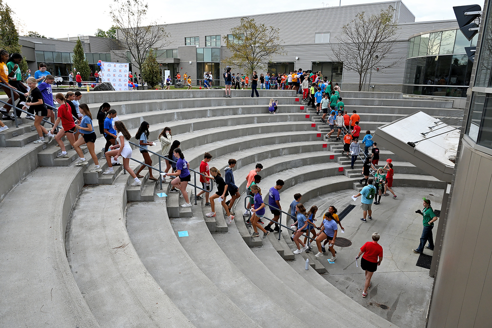 students climbing stairs in coutryard
