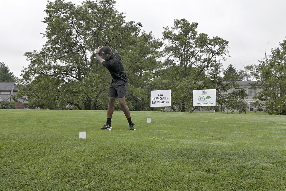 man golfing