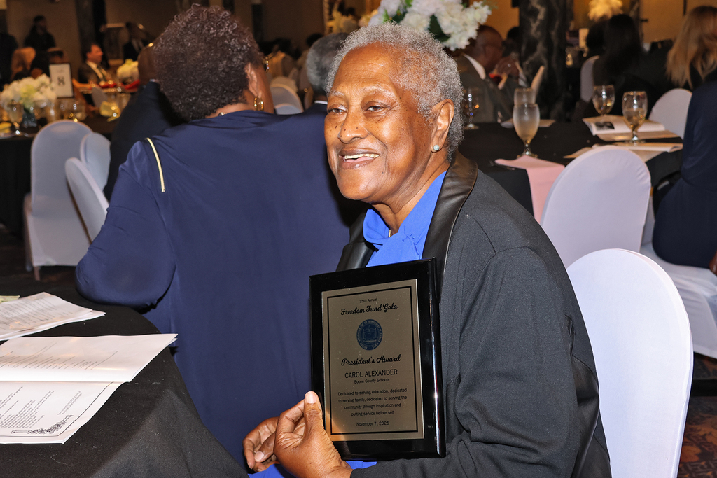 Carol Alexander with award