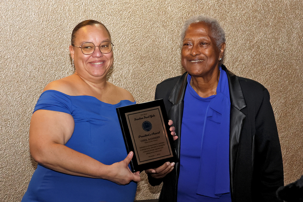 Carol Alexander with award