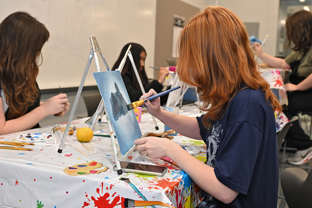 students painting