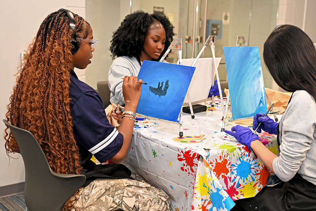 students painting