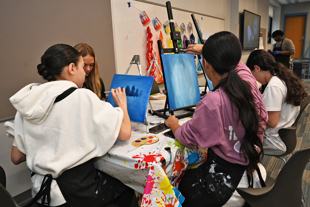 students painting