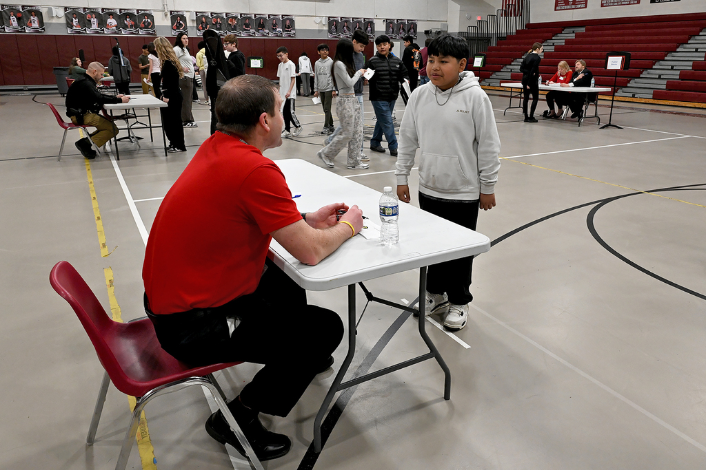 student with staff member