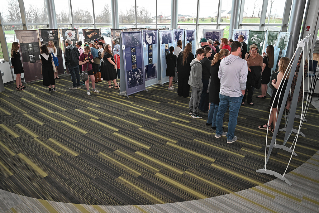 students presnting to community members at Anne Frank exhibit