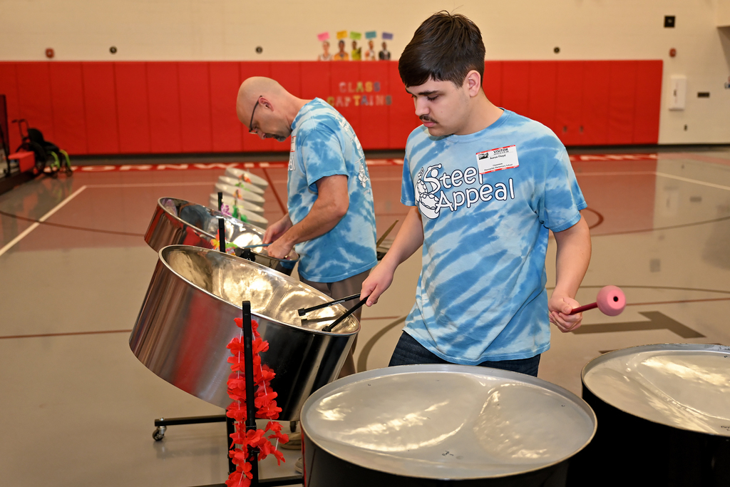 people playing steel drums