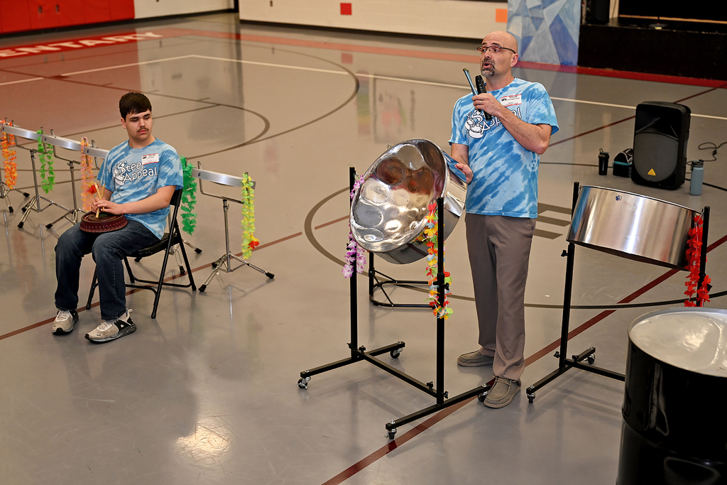 people playing steel drums