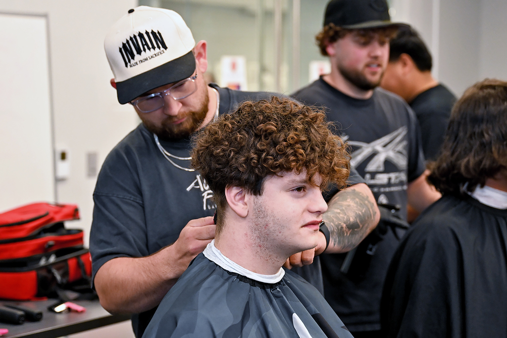 student getting a hair cut