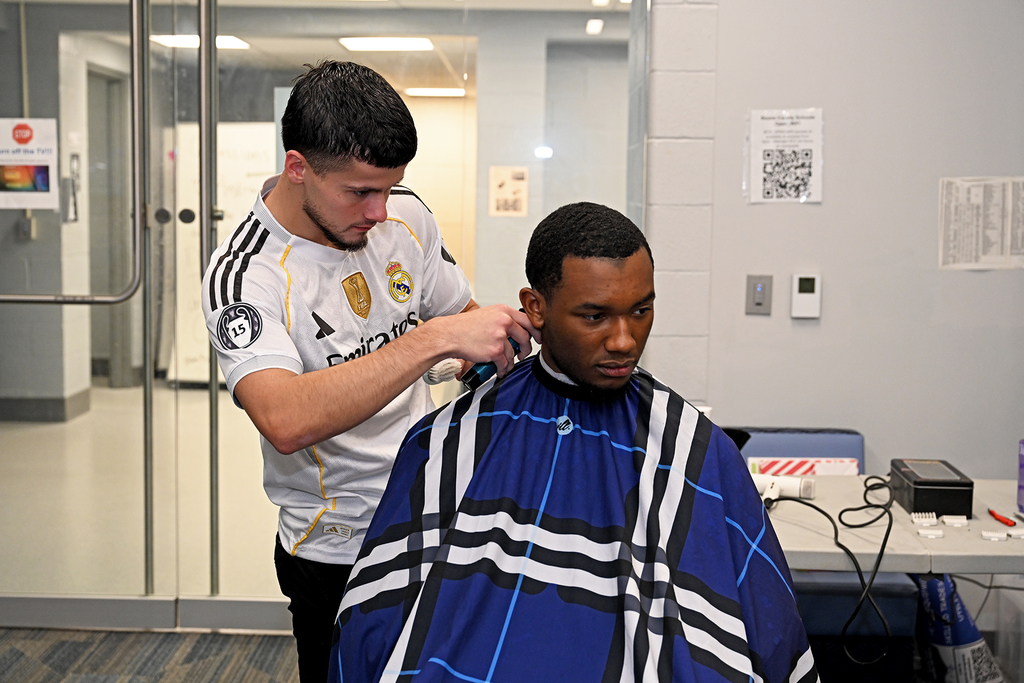 student getting a hair cut