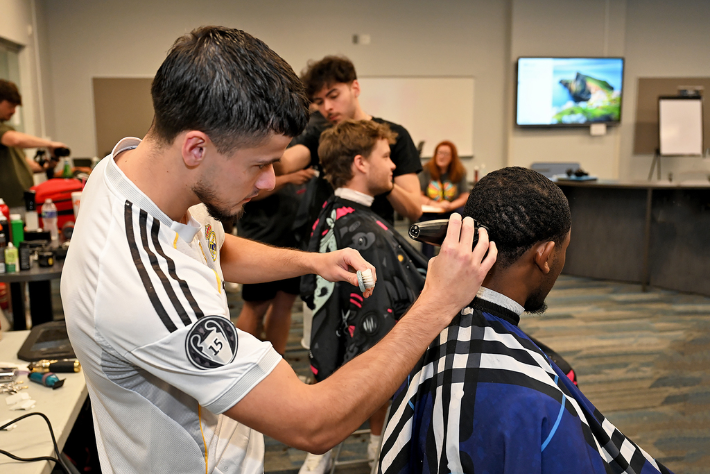 student getting a hair cut