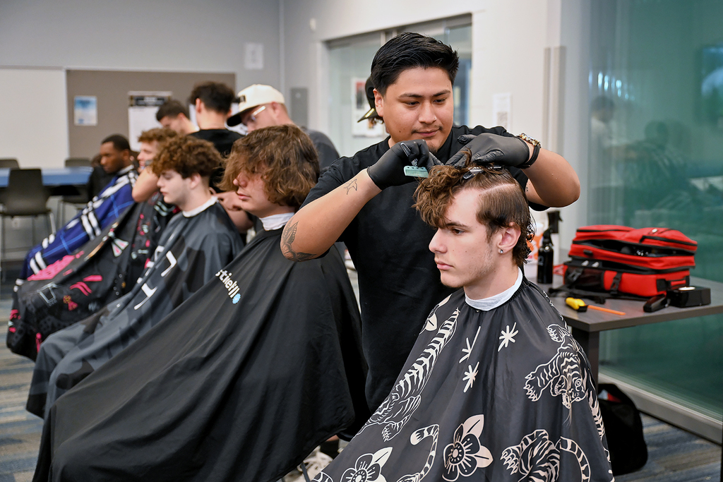 student getting a hair cut