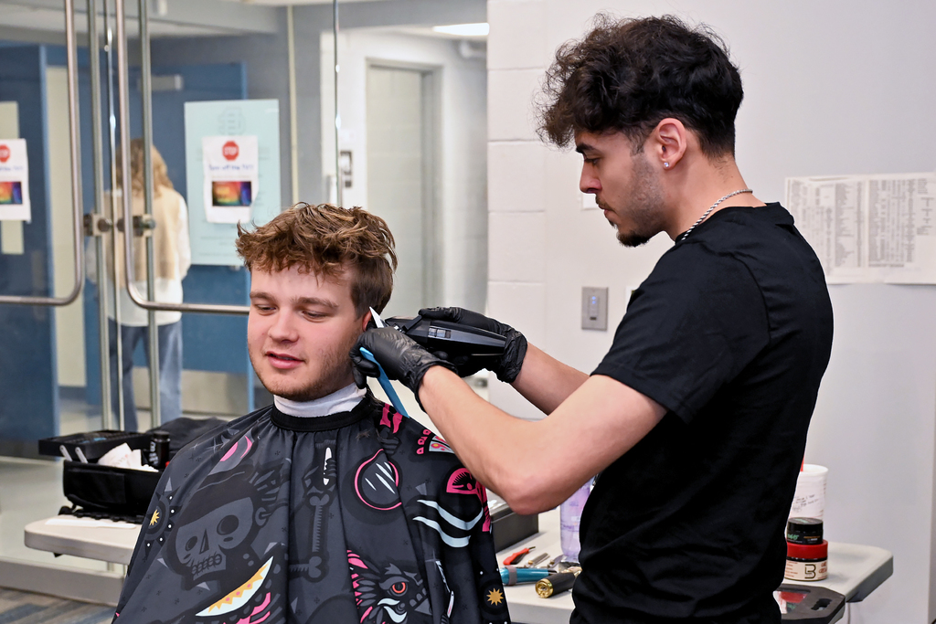 student with a barber