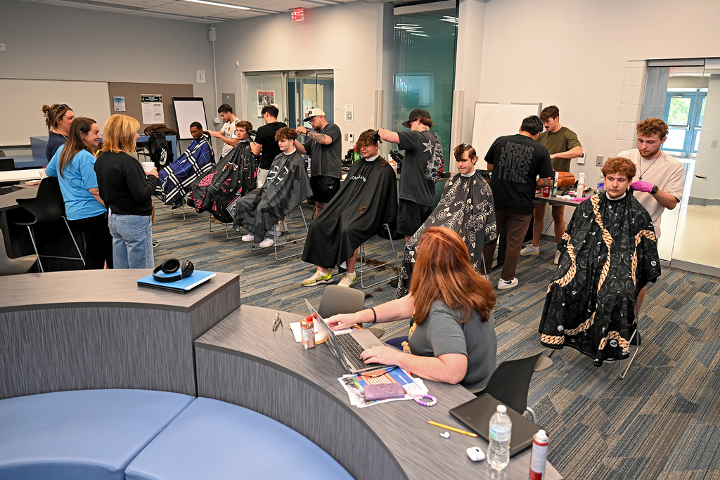 group of students getting hair cuts