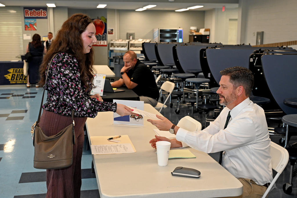 a man and a woman with a piece of paper