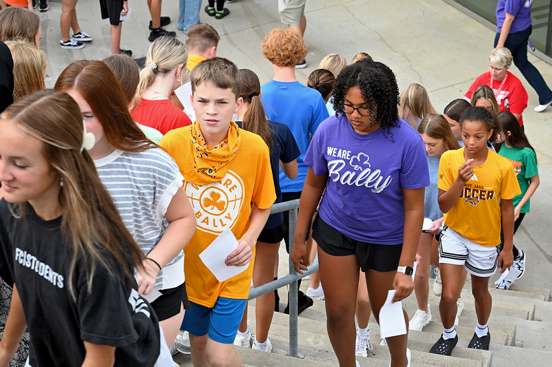 group of students climbing stairs