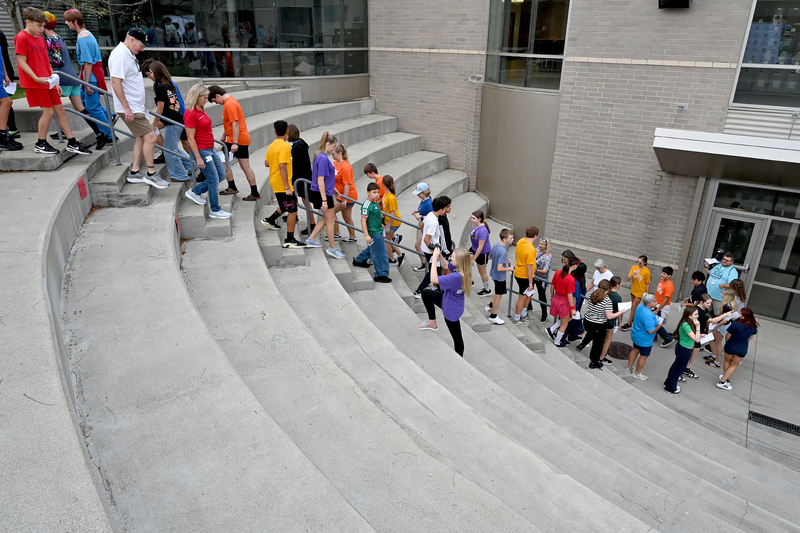 group of people climbing stairs