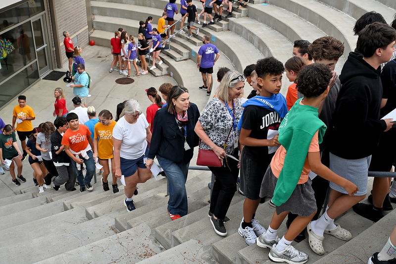 large group of people climbing stairs