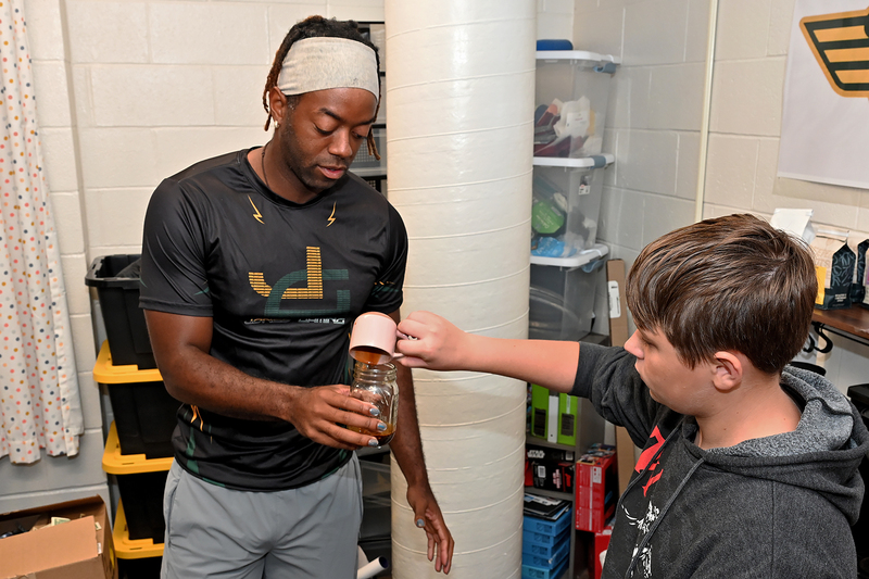 student and adult making coffee drink
