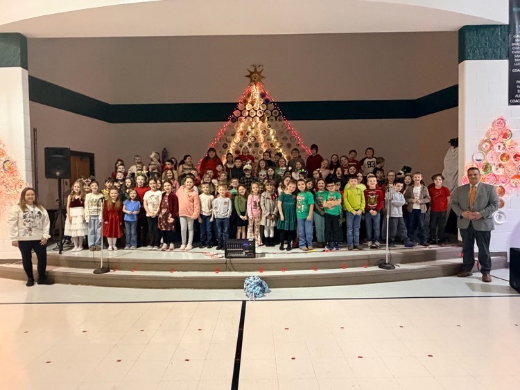 second and third grade students along with Mrs Coakley (music teacher) and Mr. Sexton (BCS Superintendent) after performing in the Christmas program  